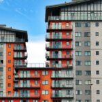 Apartments - Gray, Red, and Orange Concrete Building