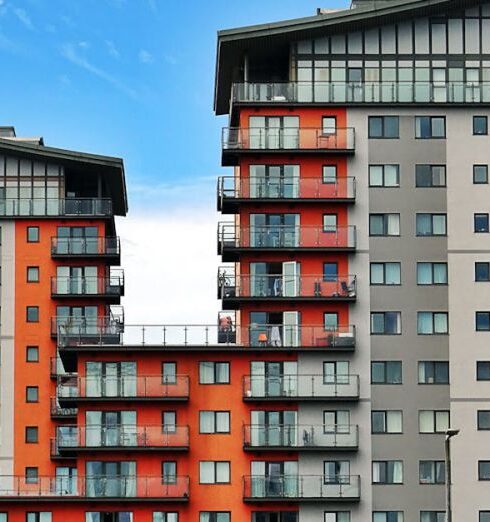 Apartments - Gray, Red, and Orange Concrete Building