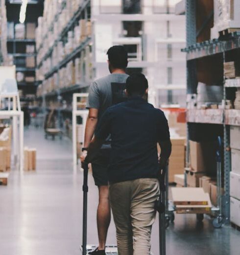 Storage - Men Going Around a Warehouse