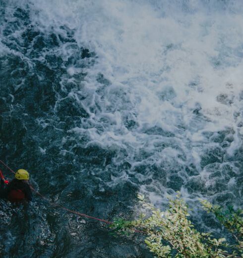 Canyoning - Photon of Man on Water Attached by Roof