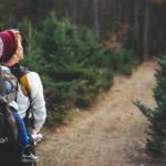 Hike - Shallow Focus on Blond Haired Woman in White Long Sleeve Shirt Carrying a Baby on Her Back