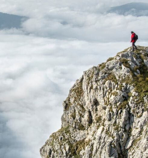 Altitude - Photography of Person on Green Mountain