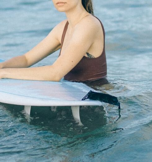 Surfing - A Woman Swimming on the Sea