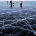 Ice Fishing - Person Wearing Orange Jacket