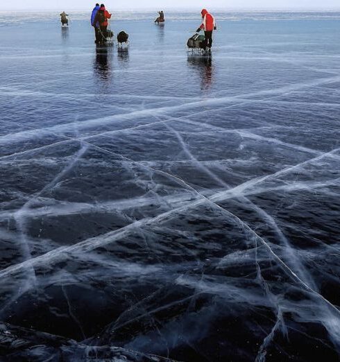 Ice Fishing - Person Wearing Orange Jacket