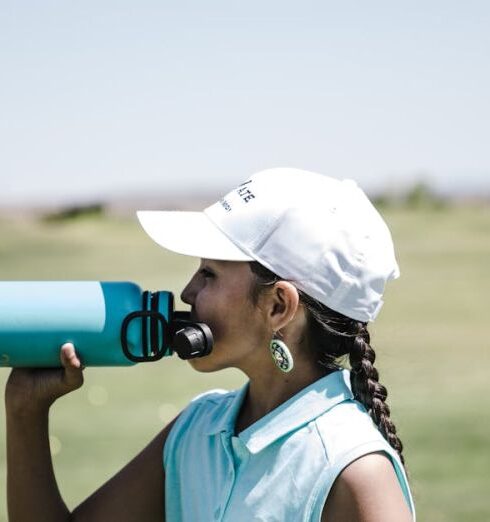 Drink Water - Woman Drinking at Blue Sports Bottle Outdoors