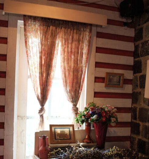 Homestay - Two Brown Window Curtains Inside White and Red Room