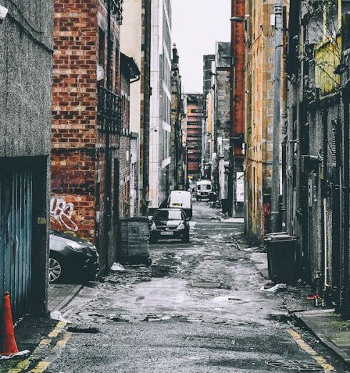 Photography - Gray and Brown Houses Beside Pathway