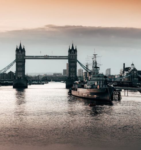 Landmarks - Black Boat Beside Bridge