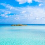 Private Island - Island In The Middle Of The Sea Under Blue Sky And White Clouds