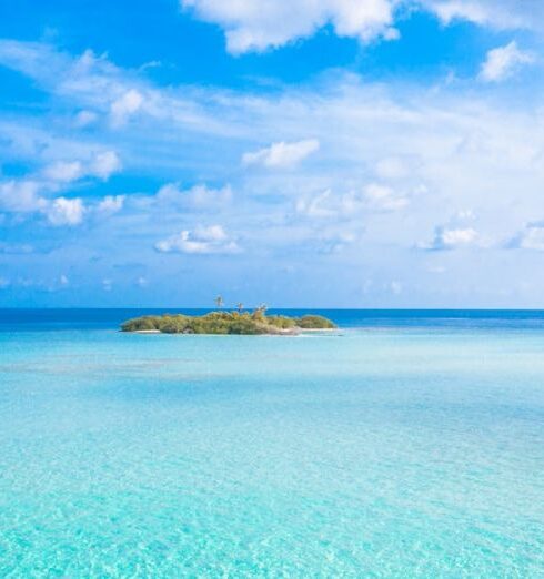 Private Island - Island In The Middle Of The Sea Under Blue Sky And White Clouds