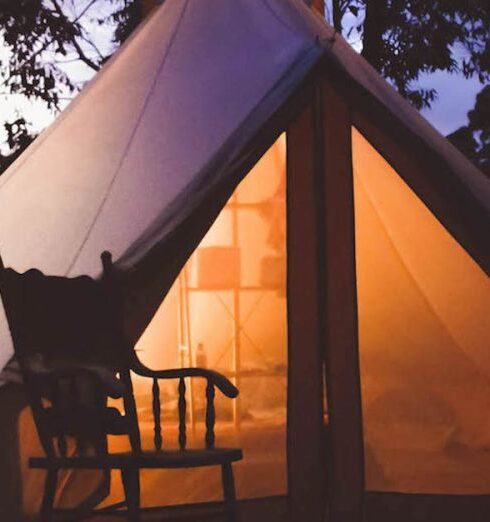 Glamping - White and Brown Lighted Cabin Tent at Woods