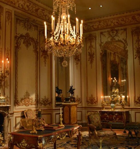 Palace - Brown Wooden Coffee Table Below an Uplight Chandelier