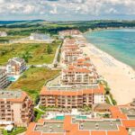 Destination Spas - Aerial Photography of Buildings Near a Beach