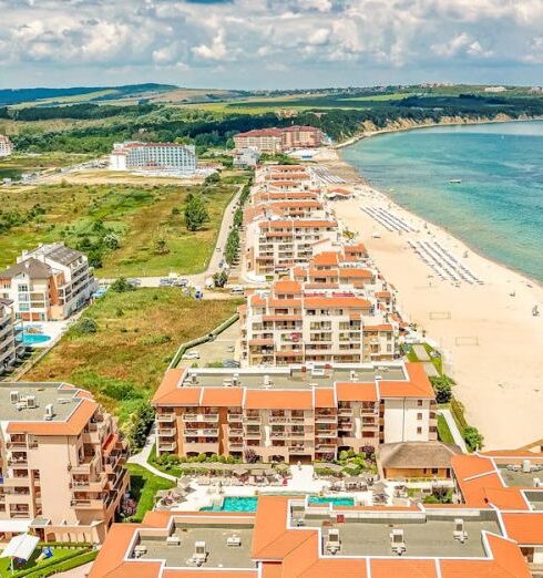 Destination Spas - Aerial Photography of Buildings Near a Beach