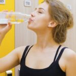 Drink Water - Woman In Black Tank Top Drinking Water