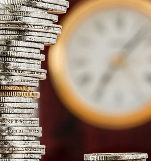 Money - Selective Focus Photo of Stacked Coins