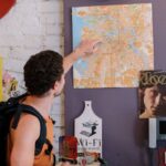 Travel Tips - Tourist Pointing on Map