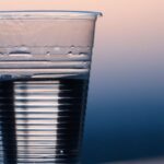 Drink Water - Clear Plastic Cup on Gray Surface