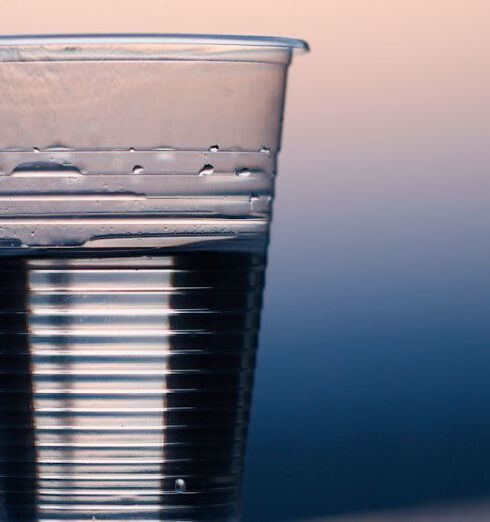 Drink Water - Clear Plastic Cup on Gray Surface