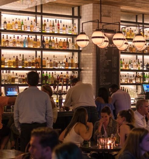 Restaurants - Group of People Gathering Inside Bar