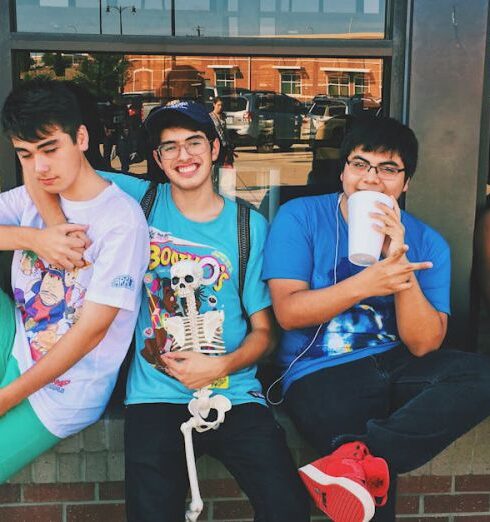 Teens - Four Men Sitting on Platform