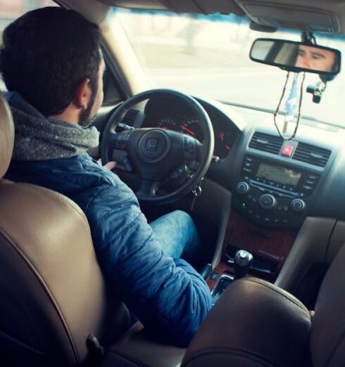 Car Ride - Man Wearing Blue Jacket Sitting Inside Car While Driving