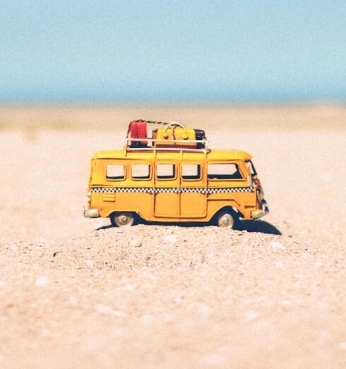 Holiday - Yellow Die-cast Miniature Van on Brown Sand