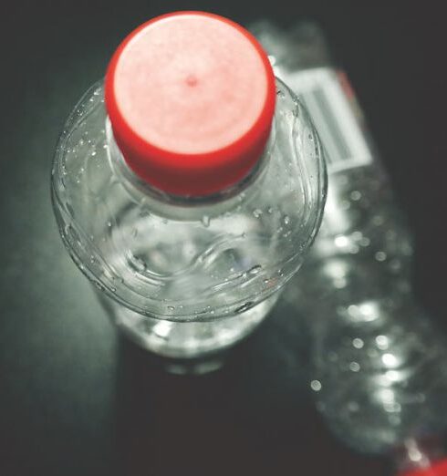 Drink Water - Two Clear Plastic Bottles on Black Surface