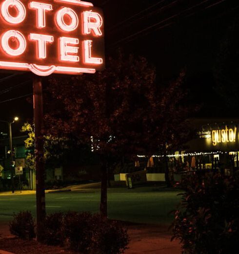 Motels - White and Red Neon Signage of a Motor Hotel