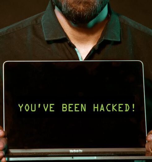 Hacks - Man Holding Laptop Computer With Both Hands