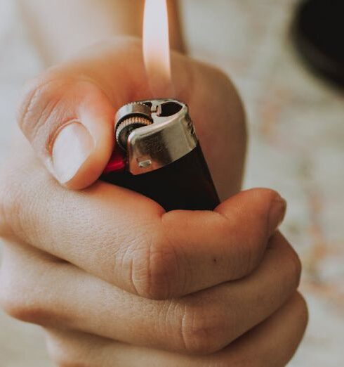 Routes - Person Holding A Lighter