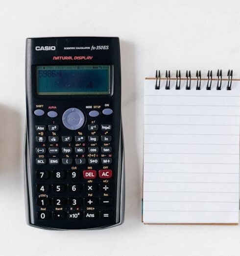 Budget - Composition of calculator with paper money and notebook with pen