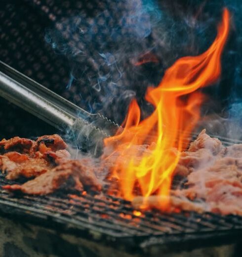 BBQ - Close-Up Photo of Man Cooking Meat