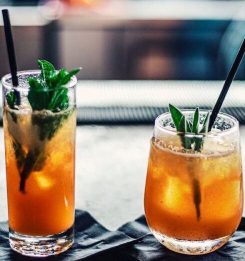 Cocktails - Two Brown Liquid Inside Clear Drinking Glasses