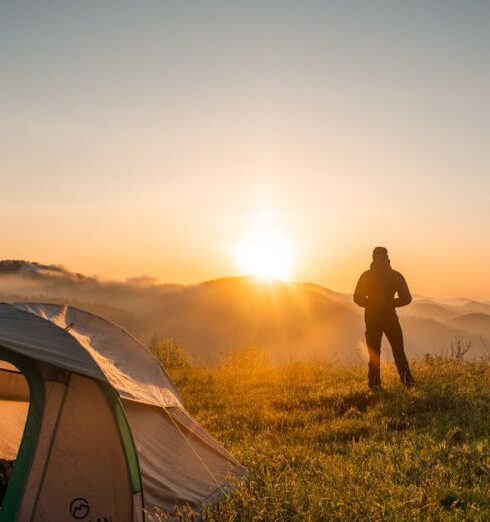 Camping - Silhouette of Person Standing Near Camping Tent