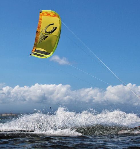 Kite Surfing - Man surfing on the Beach