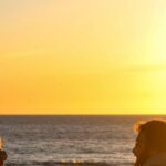 Dog-Friendly Beaches - Photo of Man and Woman with a Dog