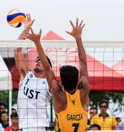 Volleyball - Two Men Playing Volleyball Near Red Canopy