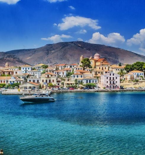 Mediterranean - White and Black Boat Sailing in Body of Water