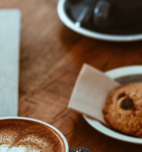 Breakfast - Black Teacup on Saucer Beside Cookie