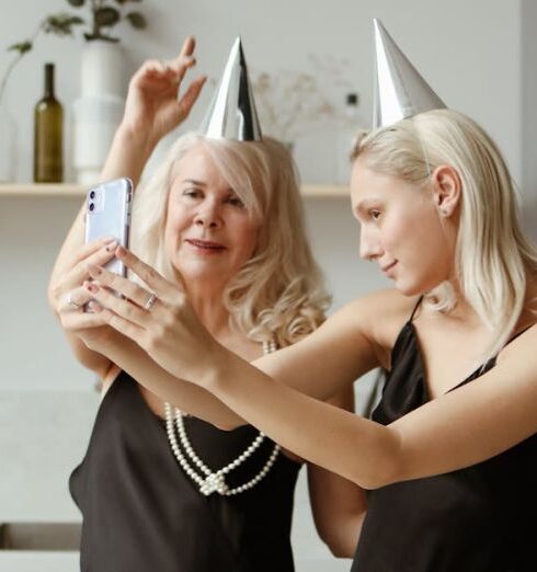 Selfie - Mother And Daughter Taking Selfie In The Kitchen