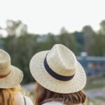 Short Trip - Women in Straw Hats Walking through Wooden Fence