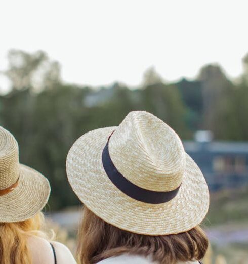 Short Trip - Women in Straw Hats Walking through Wooden Fence