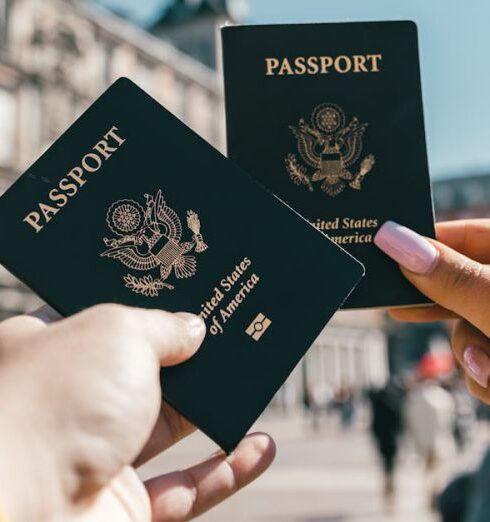 Day Trips - Anonymous tourists showing US passports on street on sunny day