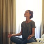 Meditation - Woman Meditating In Bedroom