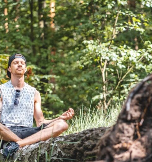 Inner Peace - Man Meditating on a Tree Log