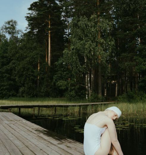 Silent Retreat - Woman Sitting on a Wooden Dock