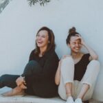 Friends - Two Women Sitting on White Bench