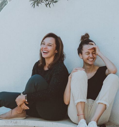 Friends - Two Women Sitting on White Bench